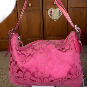 Pink Coach handbag.